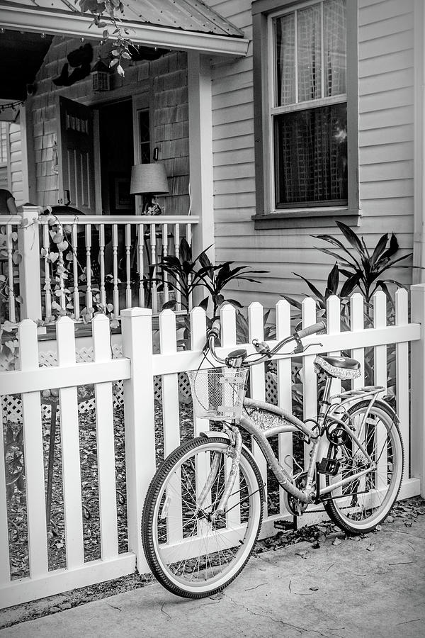 Bicycle at the Garden Fence in Black and White Photograph by Debra and Dave Vanderlaan