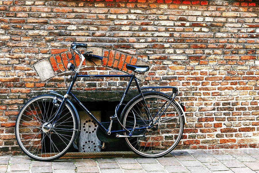Bicycle in Bruges Photograph by John Rizzuto