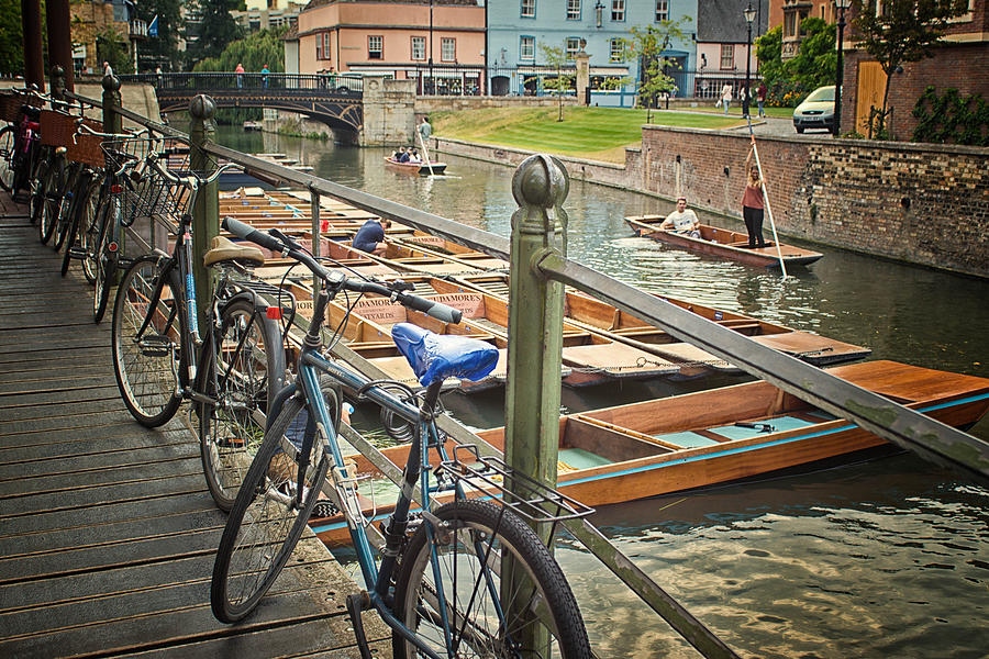Bicycles chained up near River Cam Photograph by Alphotographic