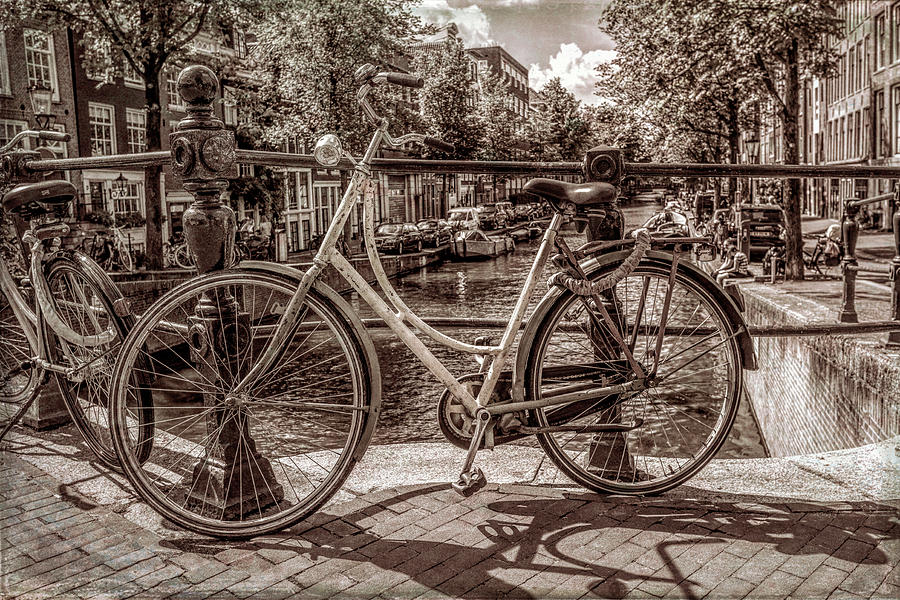 Bicycles on the Canals in Vintage Sepia Photograph by Debra and Dave Vanderlaan