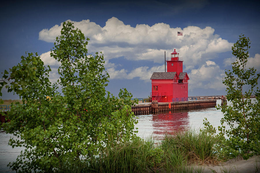 Big Red Lighthouse at Ottawa Beach viewed from between the Trees Photograph by Randall Nyhof