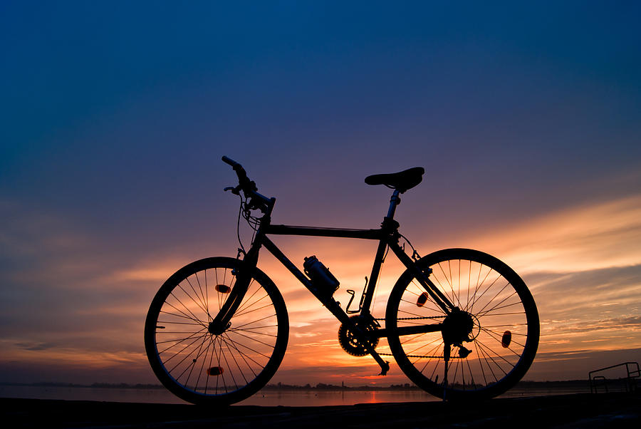 Bike in sunset Photograph by TibiP03