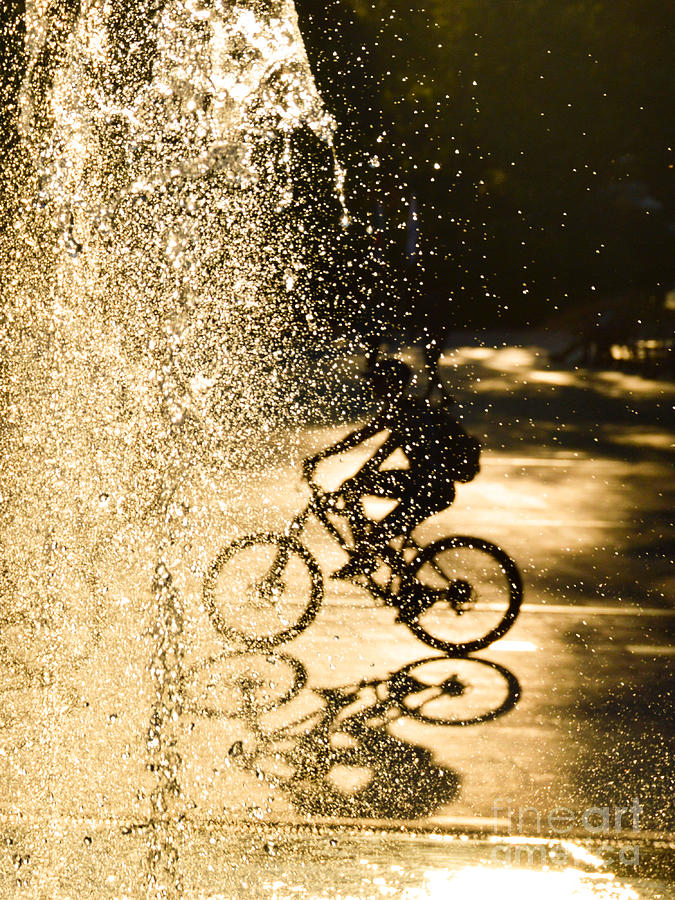 The bike rider in the water Photograph by Yavor Mihaylov