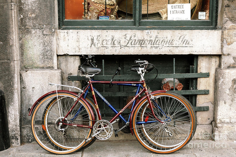 Bikes on Rue de la Commune in Old Montreal Photograph by John Rizzuto