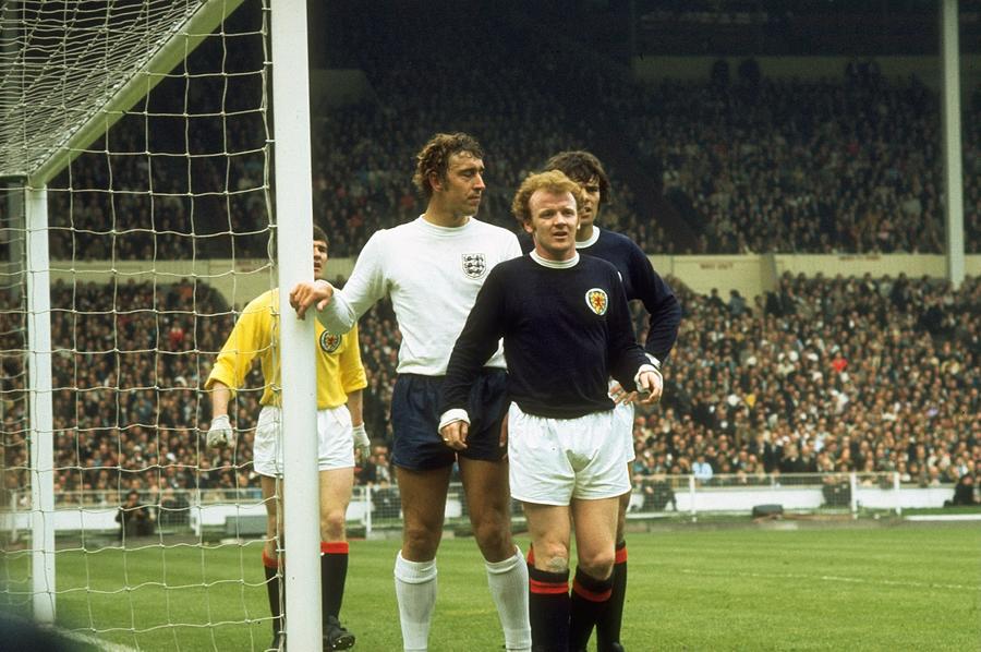 Billy Bremner and Francis Munro of Scotland, Martin Chivers of England Photograph by Getty Images