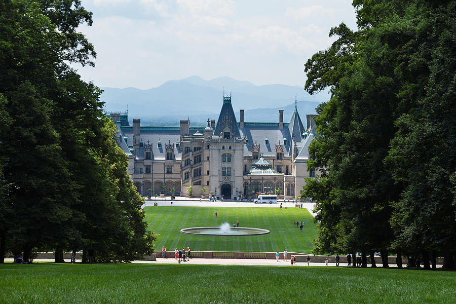 Biltmore House shines through the trees. Photograph by SLRadcliffe