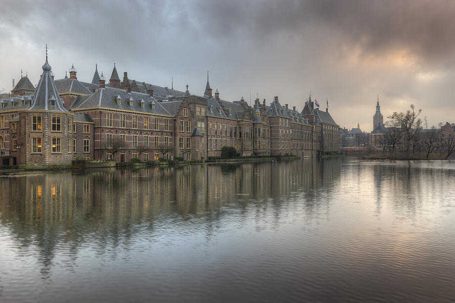 Binnenhof, Dutch Houses of Parliament, reflected in the Court Pond ( Hofvijver ) Photograph by Rob Kints