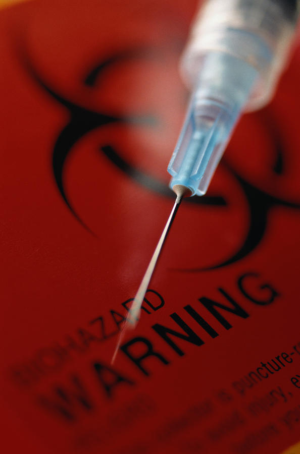 Biohazard Warning and Syringe Photograph by Don Farrall