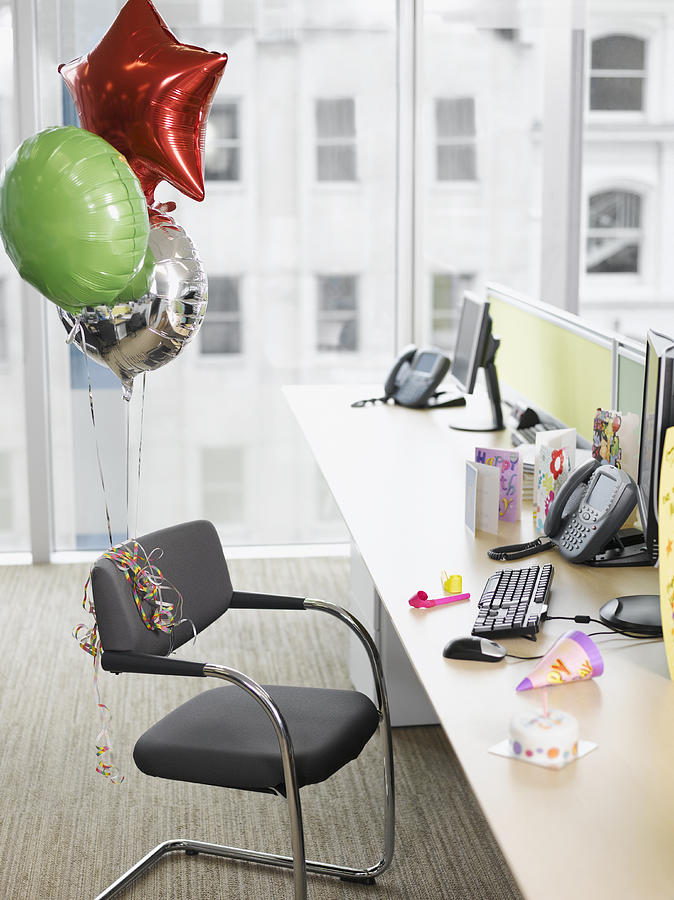 Birthday balloons tied to office chair Photograph by Robert Daly