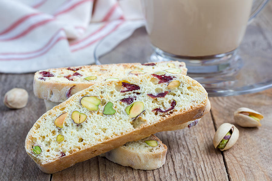 Biscotti with cranberry and pistachio with cup of coffee latte Photograph by Iuliia_n