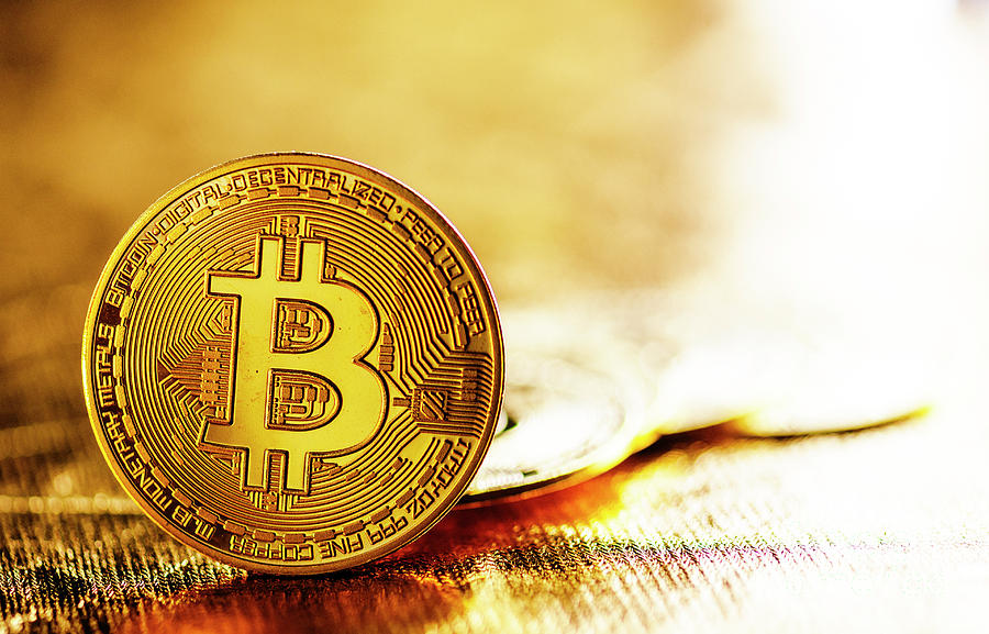 Bitcoin on gold background Photograph by Jelena Jovanovic
