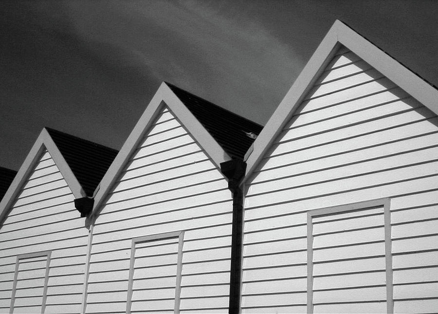 Black and White Beach Huts Photograph by Helen Jackson