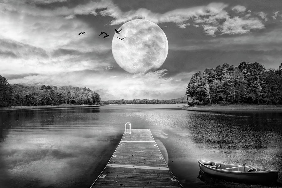 Black and White Canoe at the Moonlit Lake Dock Photograph by Debra and Dave Vanderlaan