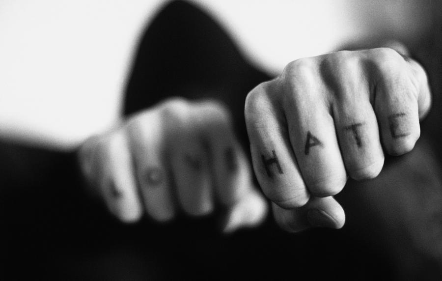 Black And White Close-up Of Fists With Love And Hate Tattooed On The Fingers Photograph by Stockbyte