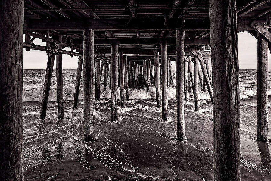Black and White Under the Boardwalk - Old Orchard Beach in Maine Photograph by Mitchell R Grosky