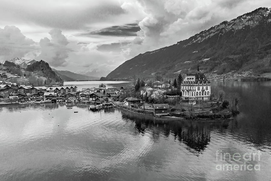 Black and white view of the famous Iseltwald village by lake Bri Photograph by Didier Marti