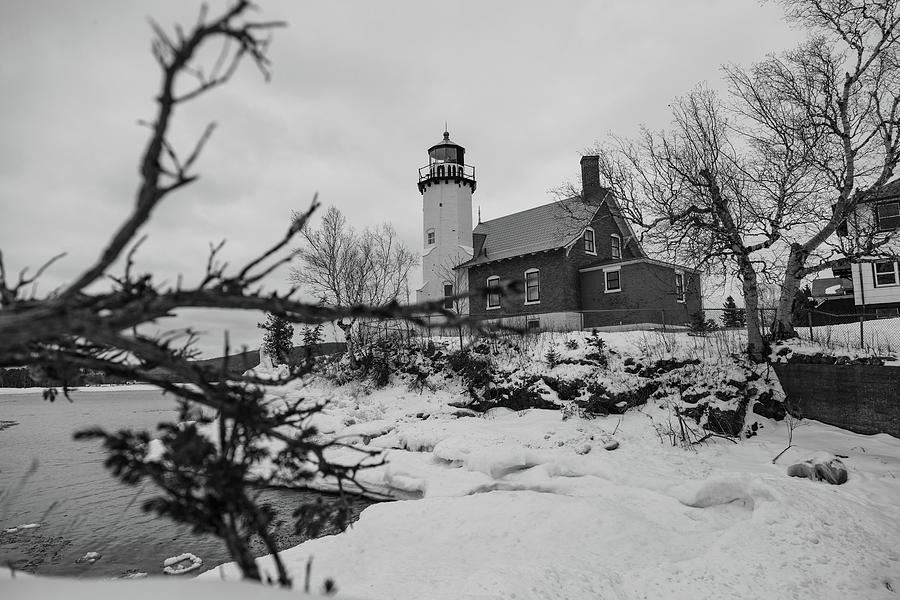 Black and white Winter view of Eagle Harbor Lighthouse in Eagle Harbor Michigan Photograph by Eldon McGraw