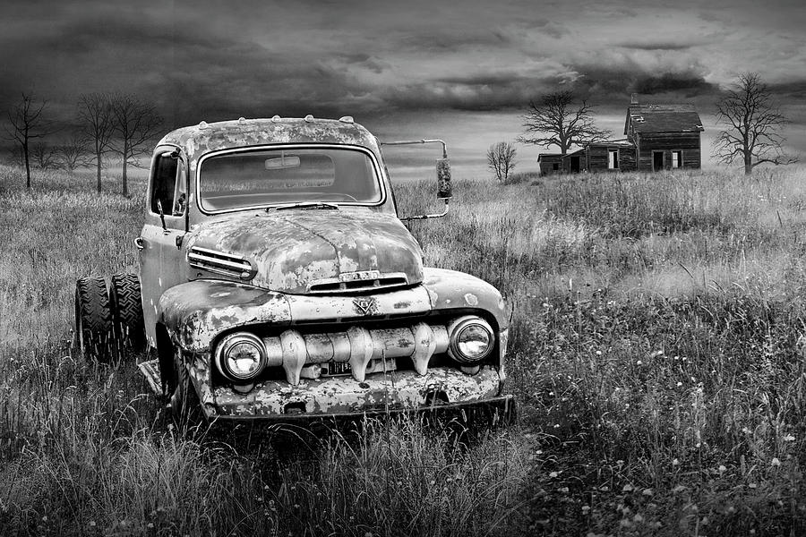Vintage Photograph - Black and White of a Rusted Vintage Ford Truck in a Grassy Field by Randall Nyhof