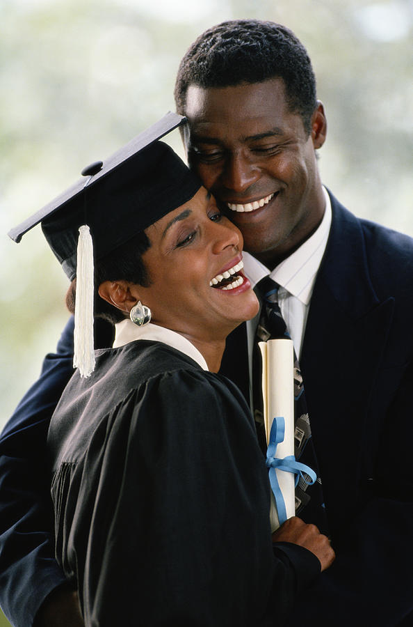 Black Couple With Woman Graduating Photograph by Yellow Dog Productions