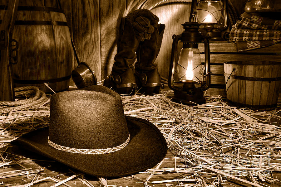 Black Cowboy Hat in an Old Barn - Sepia Photograph by Olivier Le Queinec