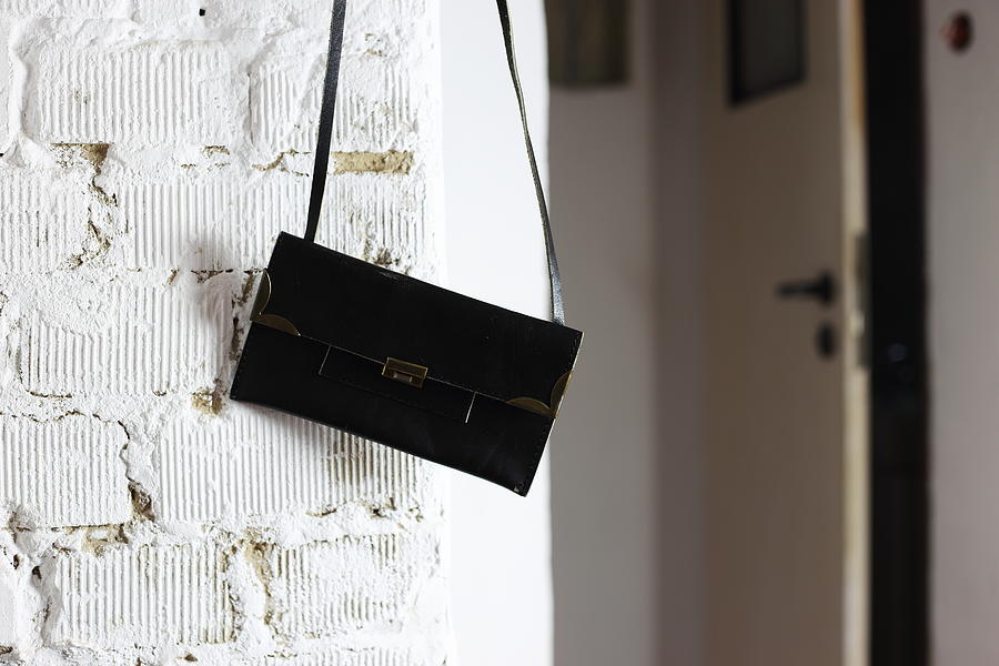 Black Handbag On The Wall Photograph by Karalon