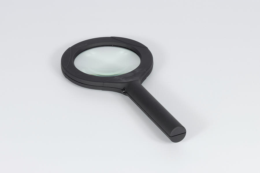 Black Magnifying gass on white background Photograph by Jack R Perry
