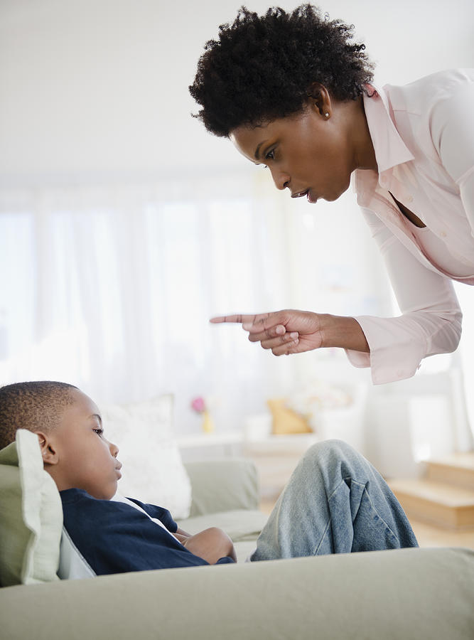 Black mother scolding son Photograph by Blend Images - JGI/Jamie Grill