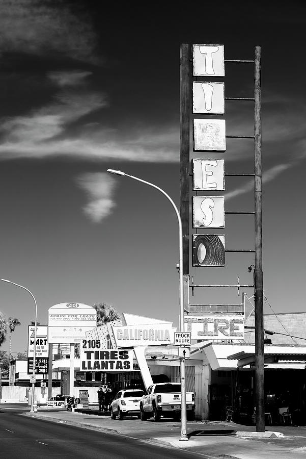 Black And White Photograph - Black Nevada Series - Las Vegas Tire by Philippe HUGONNARD