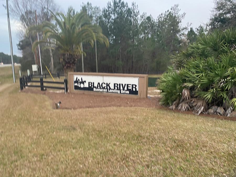 Black River Sign Photograph by Shea Holliman