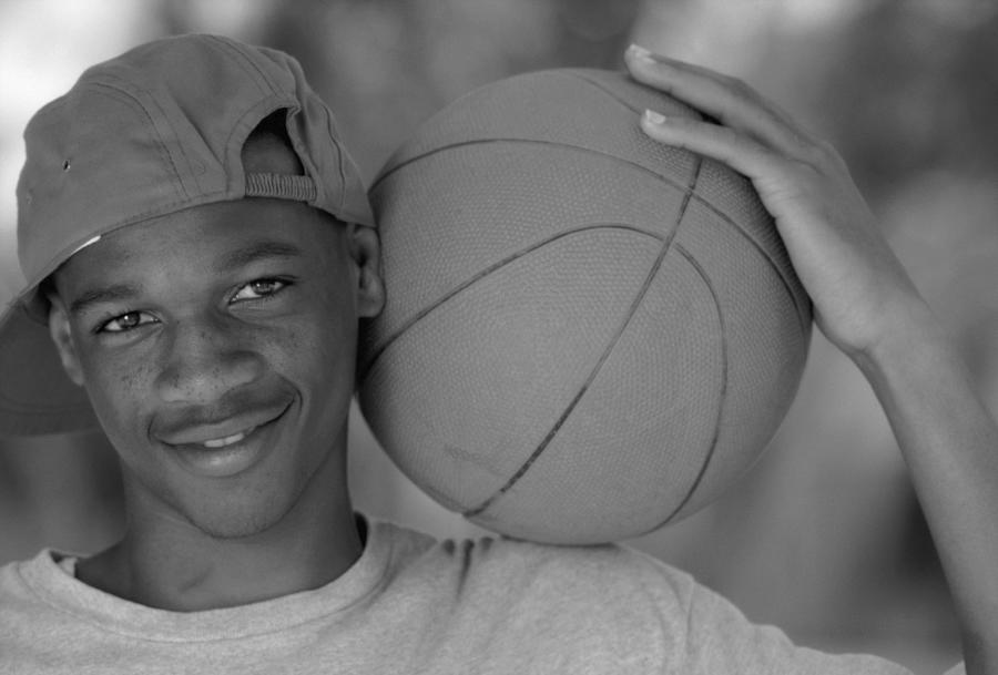 Black Teenage Male With Basketball In Black And White Photograph by Butch Martin