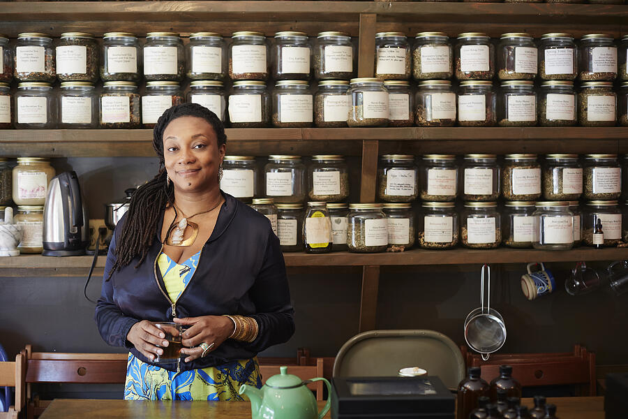 Black woman drinking tea in tea shop Photograph by Granger Wootz