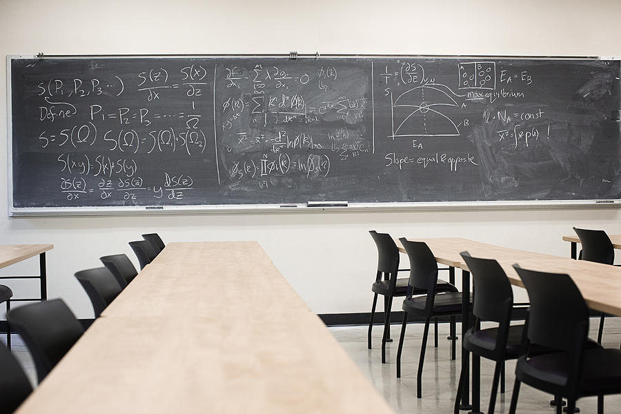 Blackboard with equations in empty classroom Photograph by Hill Street Studios