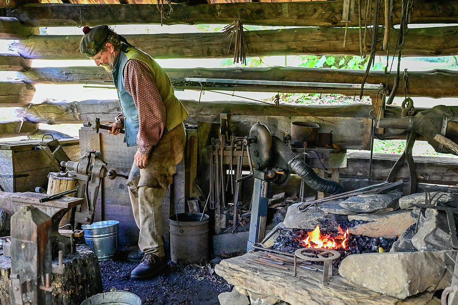 Blacksmith at work Photograph by Ed Stokes