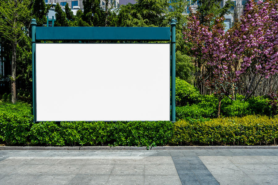 Blank Billboard in front of Empty Street Photograph by Cheunghyo