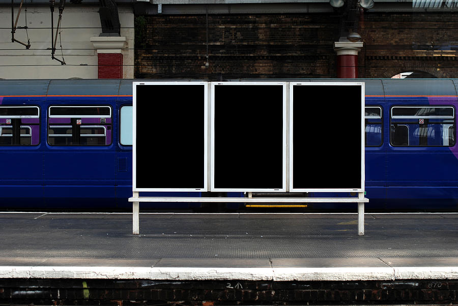 Blank billboard in train station Photograph by Ilbusca