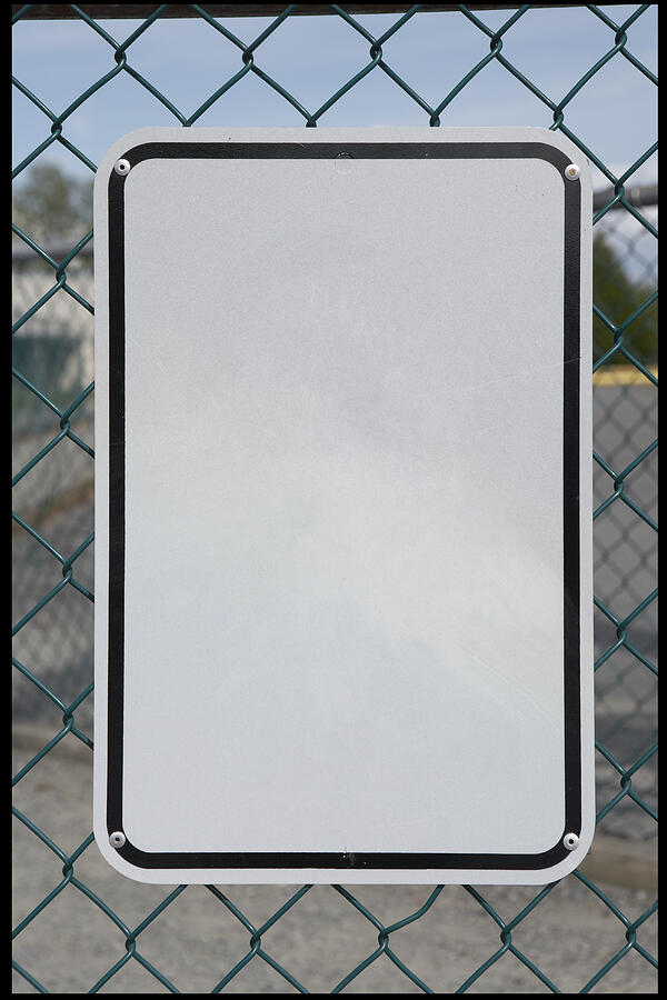 Blank black and white sign on a fence. Photograph by Laara Cerman/Leigh Righton