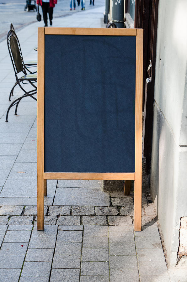 Blank sign outside a cafe (vertical) Photograph by David Crespo