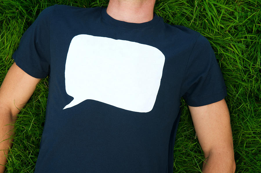 Blank speech bubble on T-shirt on grass Photograph by PeskyMonkey