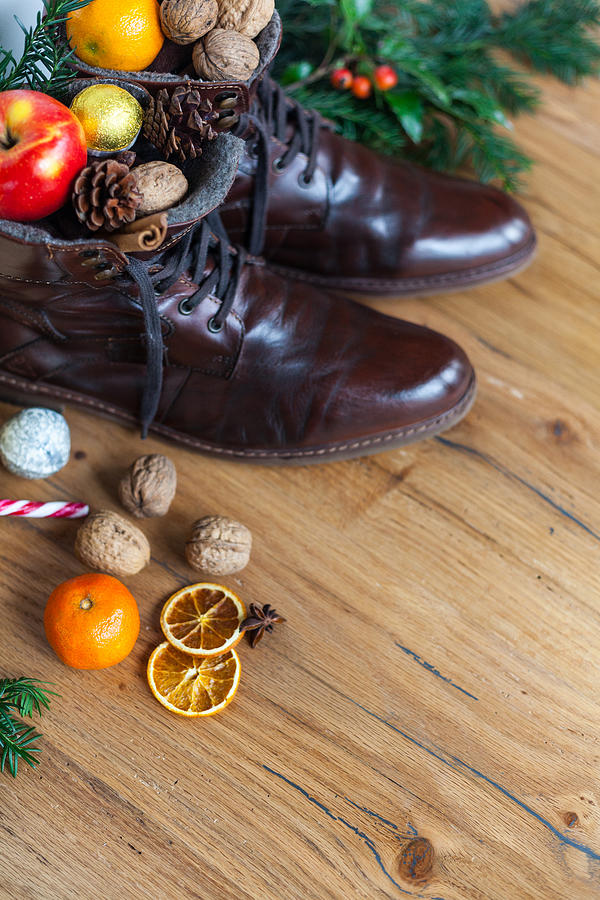 Blankly cleaned boots with sweets for st nicholas day, santa nicholas day Photograph by Michelsass