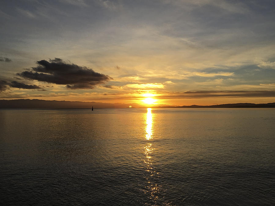 Blazing sun setting Over Strait of Juan De Fuca Photograph by Silentfoto