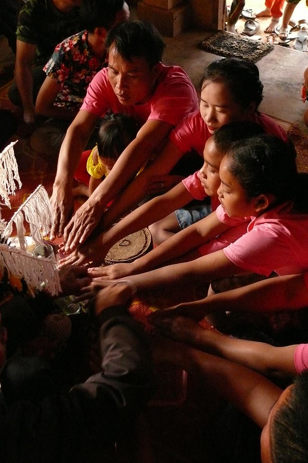 Blessing ceremony in Laos Photograph by Robert Bociaga