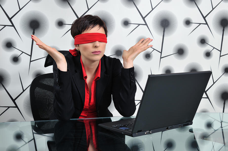 Blindfolded business woman Photograph by Inkastudio