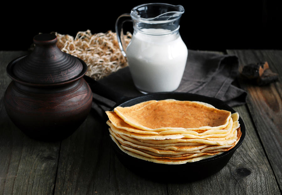 Blintzes on iron skillet, countryside Photograph by Arx0nt