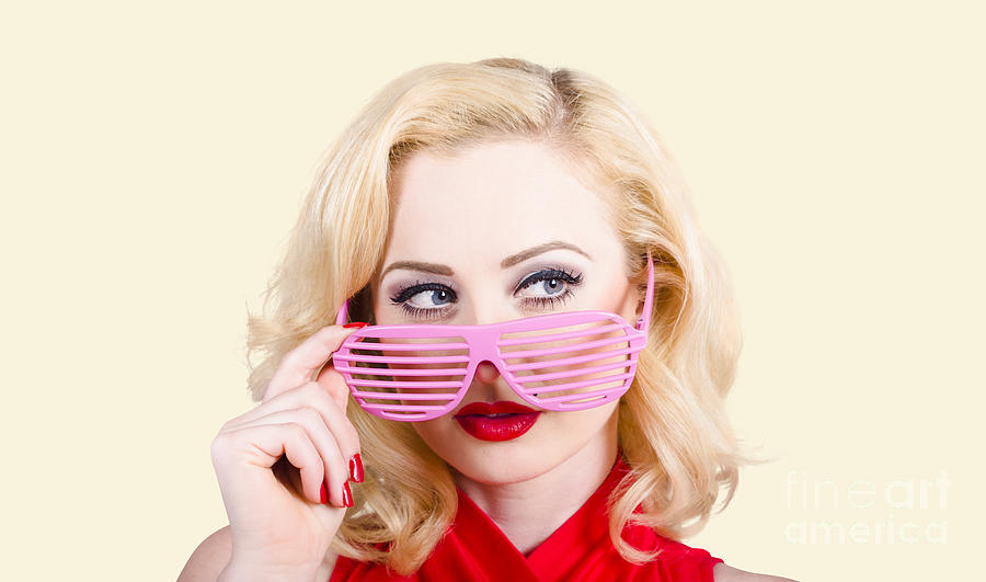 Blond pinup girl in stylish retro pink shades Photograph by Jorgo Photography