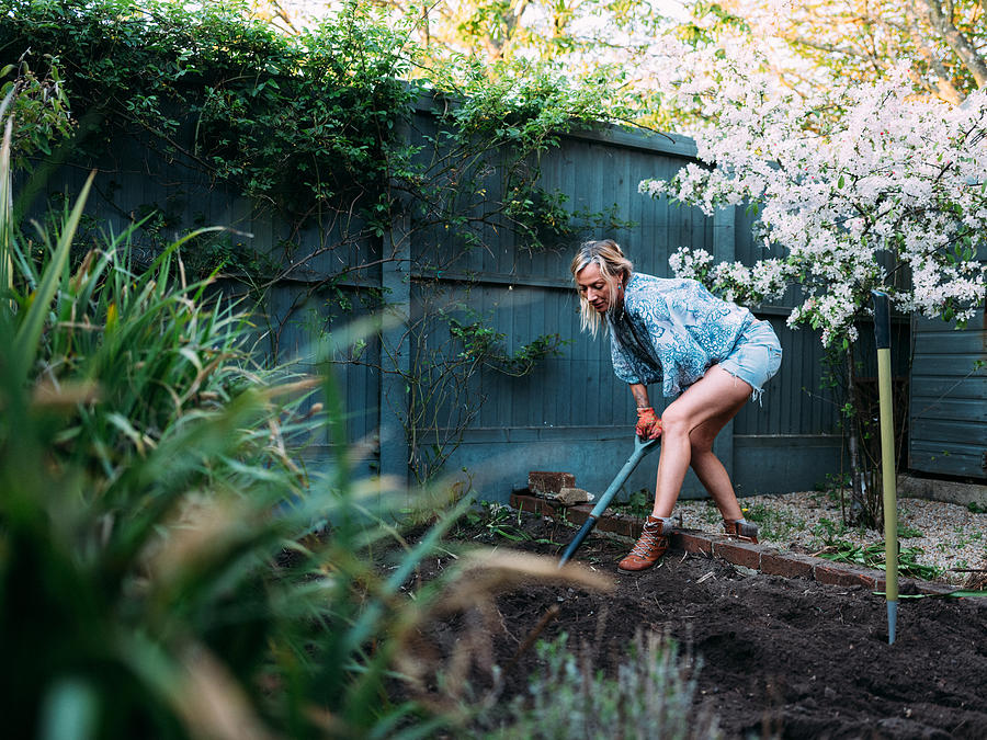 Blonde Female Gardening Photograph by Matt Porteous
