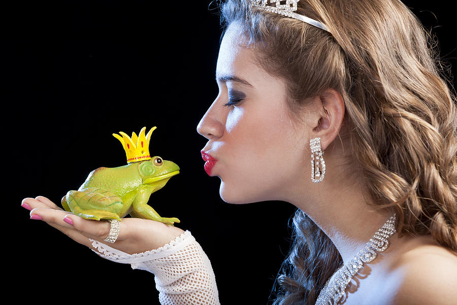 Blonde princess kissing a frog prince Photograph by Grafissimo