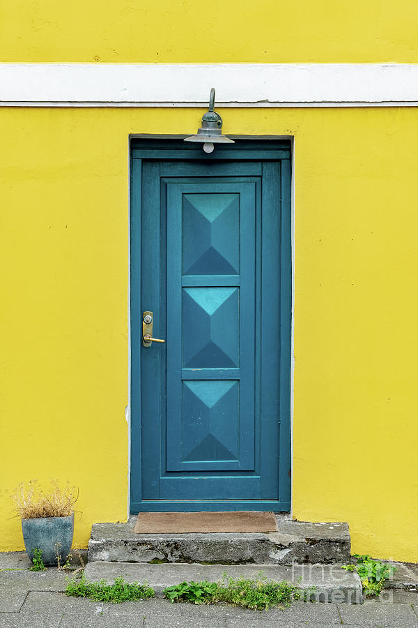 Blue and yellow door, Reykjavik, Iceland Photograph by Delphimages Photo Creations