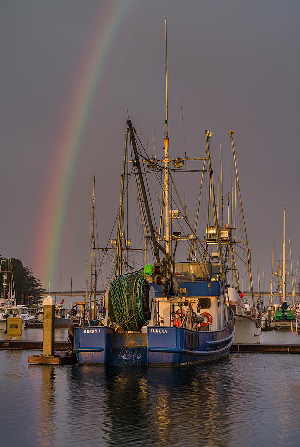 Sunset Photograph - Blue Boat and Rainbow by Greg Nyquist