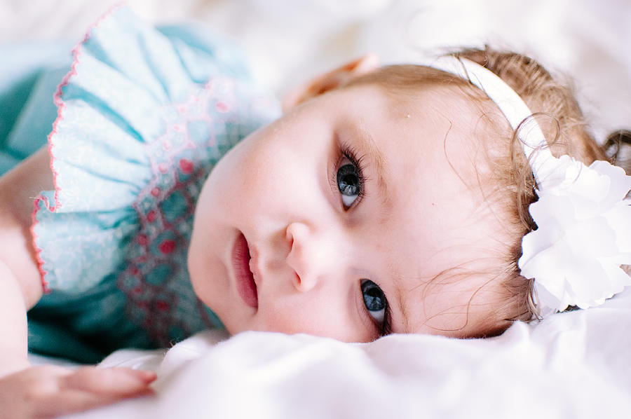 Blue Eyed Baby Girl Lying Down Photograph by Photograph by John David Pittman