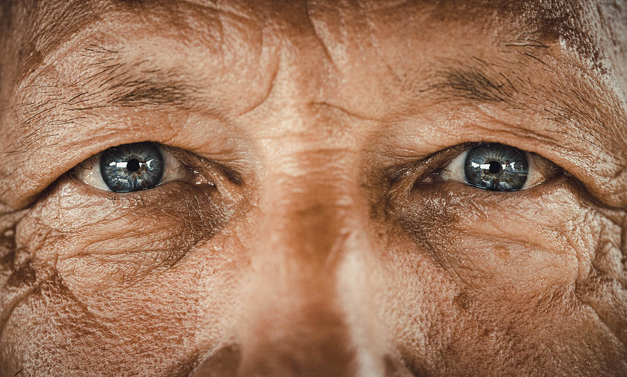 Blue-eyed senior man. Photograph by Skynesher